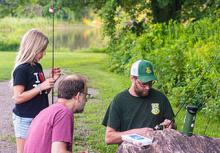 family with fishing instructor