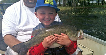 young boy with fish