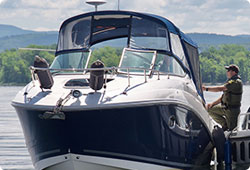 warden checking a motor boat