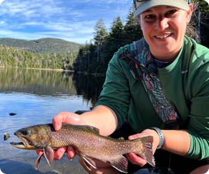 Angler with brook trout at Sterling Pond