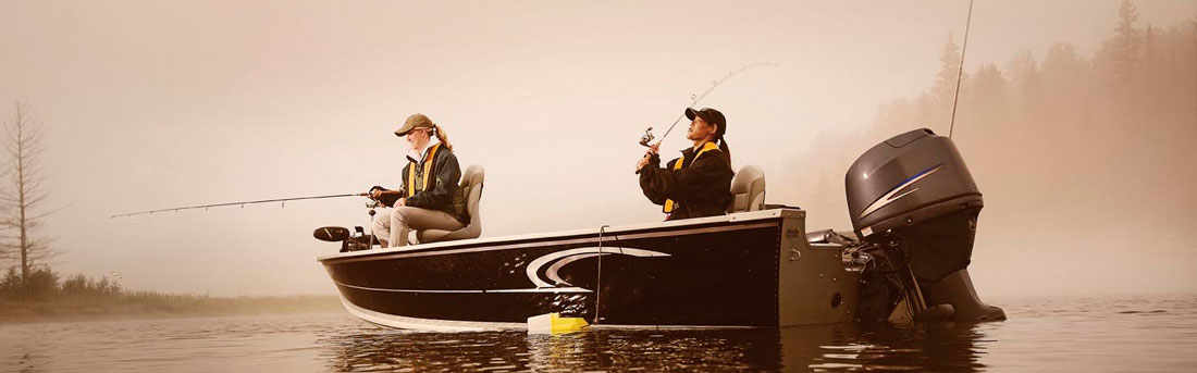 two women fishing from a boat