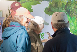 several people standing in front of a display