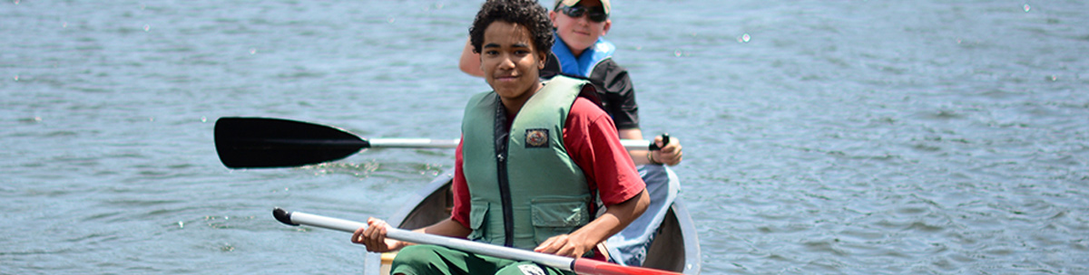 Two youths in a small boat